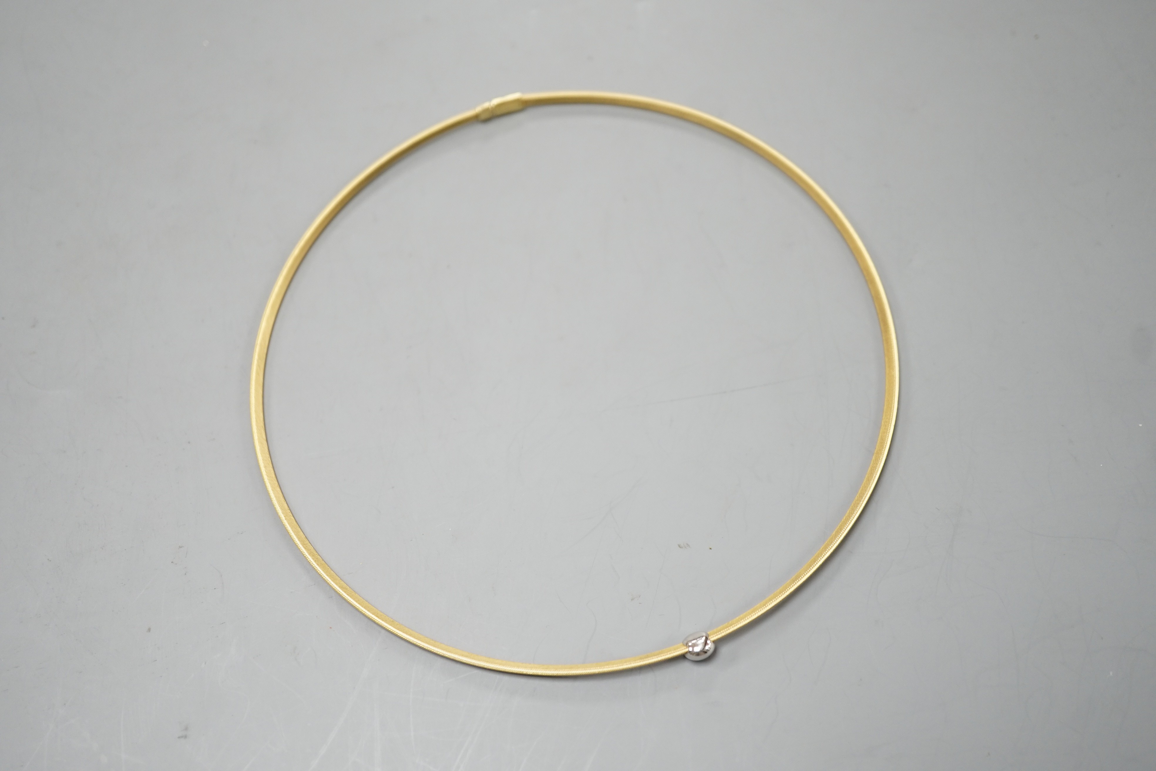 A modern 750 yellow metal and solitaire diamond set necklet, approx. 34-36cm, gross weight 8.2 grams.
